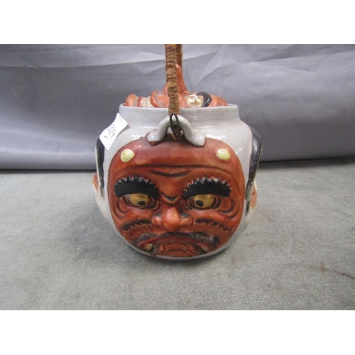 1717 - JAPANESE TEAPOT RELIEF MOULDED WITH FACES, 14CM H