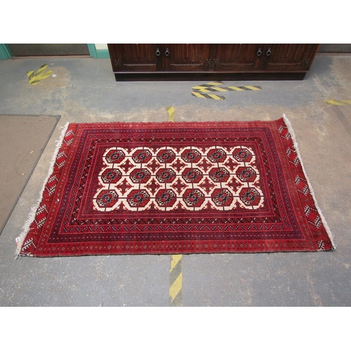 1878 - ORIENTAL RED AND FAWN GROUND RUG 111.5 x 182 cms