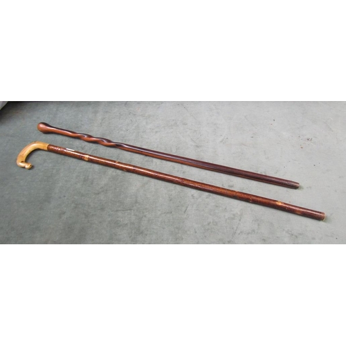 1307 - TWO WALKING STICKS - ONE CARVED HORN HANDLED