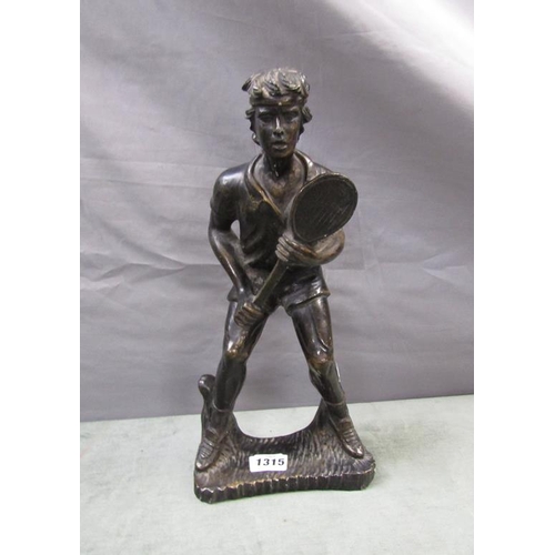 1315 - PATINATED BRONZED FIGURE OF A TENNIS PLAYER, 35CM H