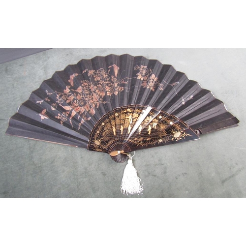 1329 - ORIENTAL BLACK LACQUERED AND GILT DECORATED FAN, 37CM W