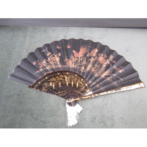 1329 - ORIENTAL BLACK LACQUERED AND GILT DECORATED FAN, 37CM W