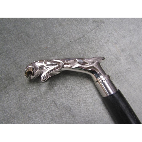 1555 - EBONISED WALKING CANE WITH A CHROME METAL CAST JAGUAR HANDLE