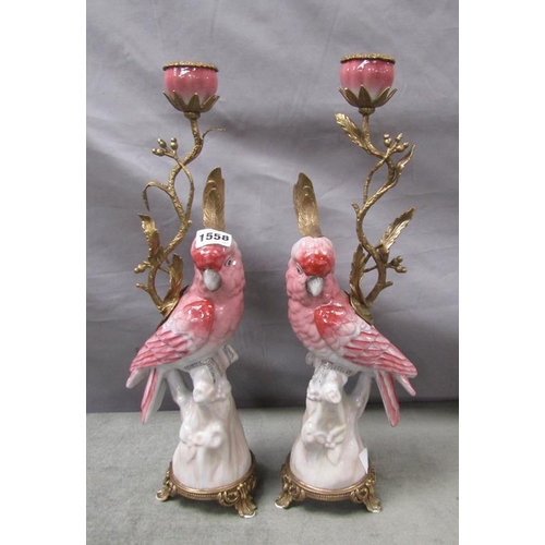 1558 - PAIR OF PINK GLAZED PARAKEET AND GILT METAL CANDLESTICKS, EACH 40cms H