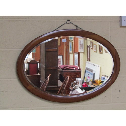 1269 - EDWARDIAN OVAL MAHOGANY INLAID WALL MIRROR, 57CM X 82CM