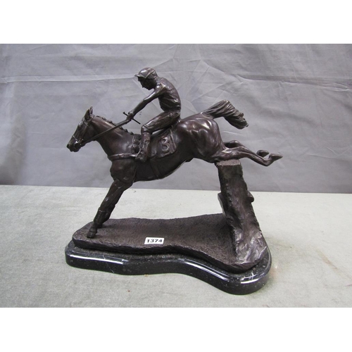 1374 - BRONZED FIGURE GROUP OF A HORSE AND JOCKEY JUMPING THE FENCE - 35cms W