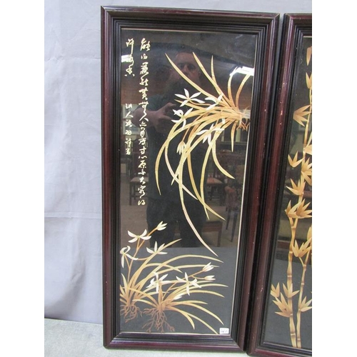 1383 - PAIR OF ORIENTAL SPLIT BAMBOO FRAMED AND GLAZED PANELS WITH SCRIPT- 35 x 80 cms