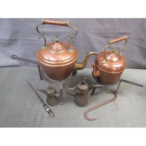 1395 - TWO CAST IRON FIRE TRIVETS, TWO COPPER KETTLES AND OTHER METALWORK