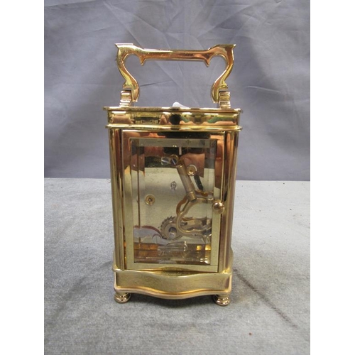 1426 - BRASS CASED CARRIAGE CLOCK BY HESTER CLARK - 16.5cms H WITH THE HANDLE RAISED