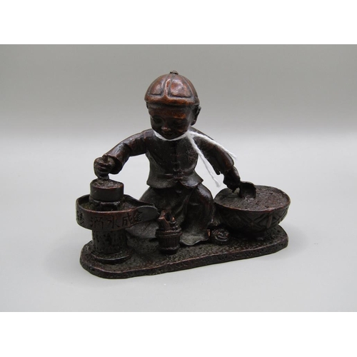 1481 - BRONZED FIGURE OF A MAN COOKING