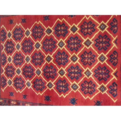 1939 - ORIENTAL RED GROUND GEOMETRIC PATTERNED WOOLLEN RUG