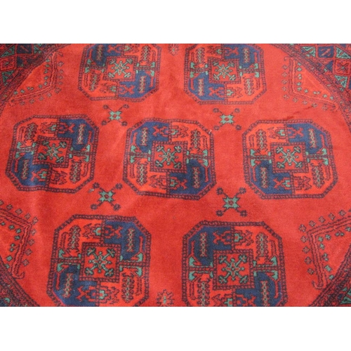 1941 - ORIENTAL RED GROUND WOOLLEN TASSEL CIRCULAR RUG