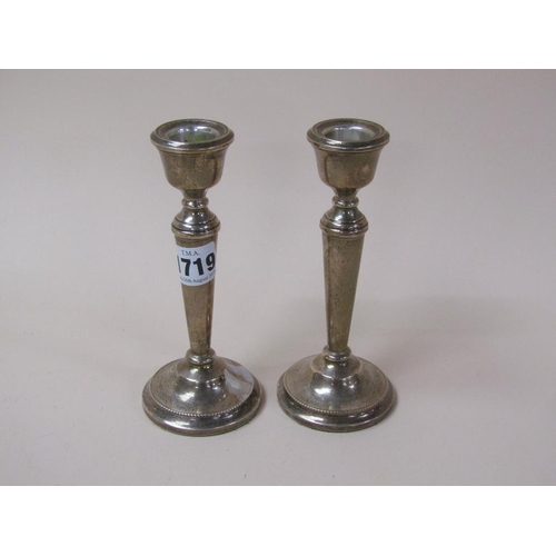 1719 - PAIR OF SILVER CASED CANDLESTICKS