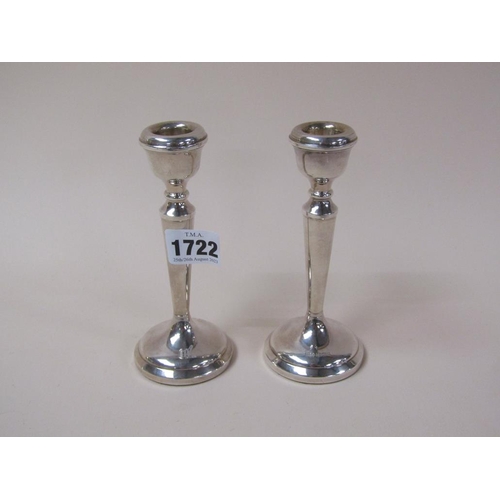 1722 - PAIR OF SILVER CASED CANDLESTICKS