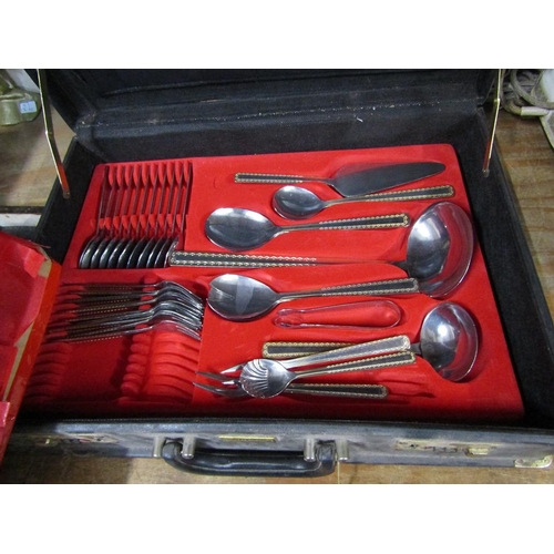 69 - LEATHER CASE OF CUTLERY AND ONE CANTEEN