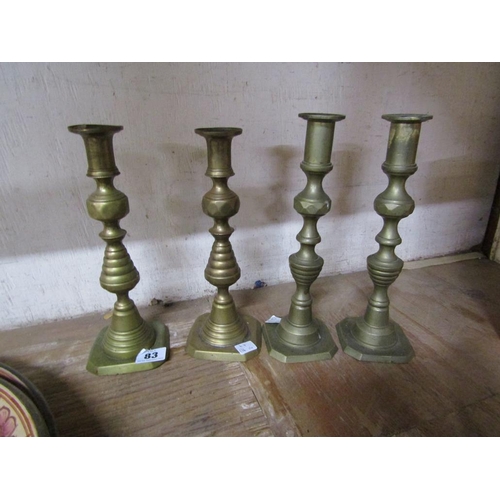 83 - TWO PAIRS OF ANTIQUE CANDLESTICKS