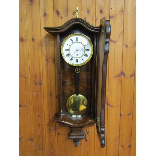 23 - A late 19c Austrian single weight Vienna regulator in a small serpentine walnut case.  The movement ... 