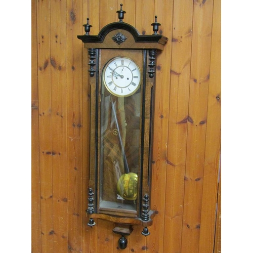 24 - A late 19c German two weight Vienna regulator in glazed walnut and ebonised case with turned finials... 