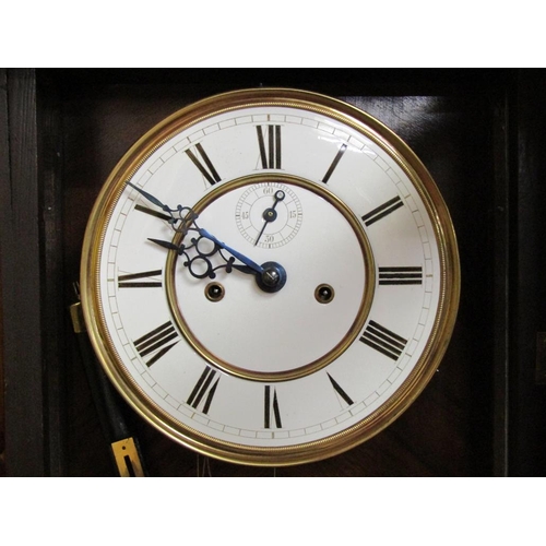 24 - A late 19c German two weight Vienna regulator in glazed walnut and ebonised case with turned finials... 