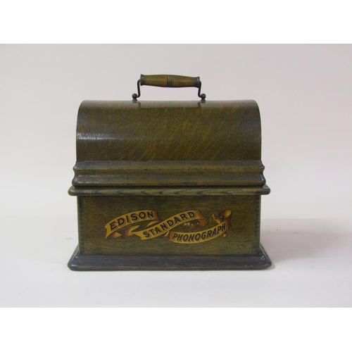 26 - An early 20c Edison standard Phonograph, serial no.8182424 in oak case with barrel shaped lid and to... 