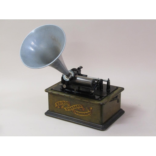 26 - An early 20c Edison standard Phonograph, serial no.8182424 in oak case with barrel shaped lid and to... 