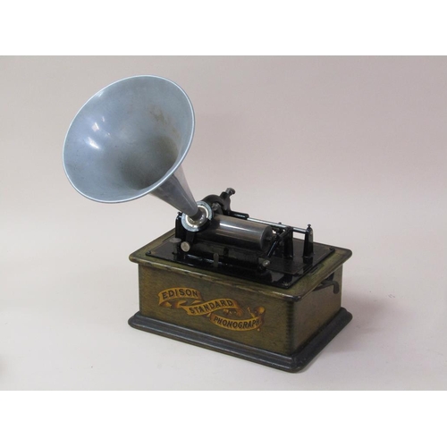 26 - An early 20c Edison standard Phonograph, serial no.8182424 in oak case with barrel shaped lid and to... 