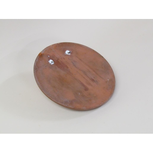 46 - A circular terracotta wall plaque depicting the face of a young child, 27cm diam.