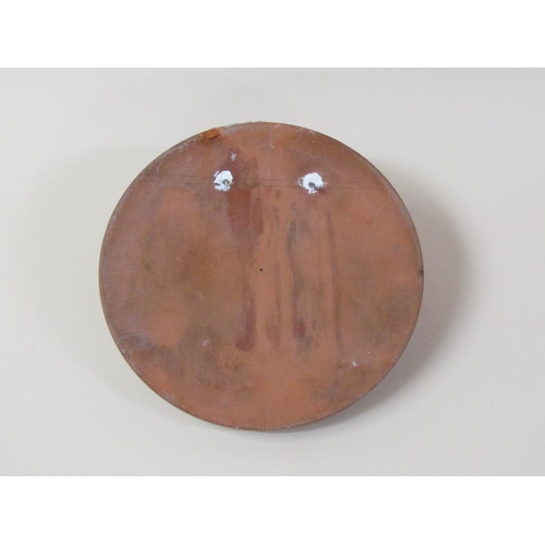 46 - A circular terracotta wall plaque depicting the face of a young child, 27cm diam.