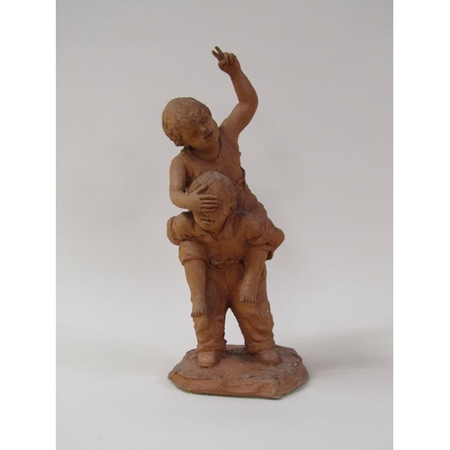 48 - A terracotta figure group of two children playing, 41cm h.