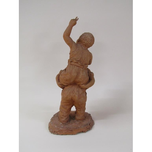 48 - A terracotta figure group of two children playing, 41cm h.