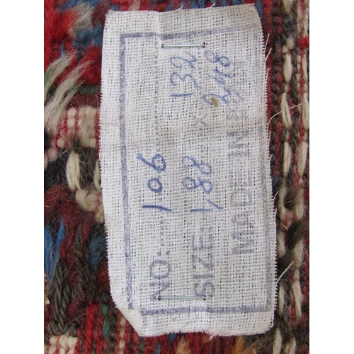 56 - An Iranian woollen rug of red, blue ground decorated with lions and flowers within three borders, 13... 