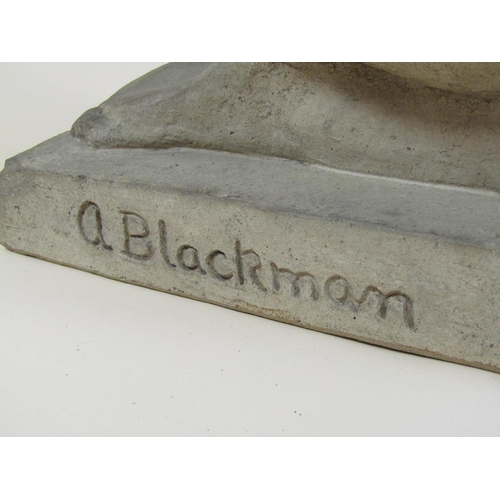 14 - A composite stone figure of a kneeling naked lady holding a rabbit, marked A. Blackman 1936. 68cm h.