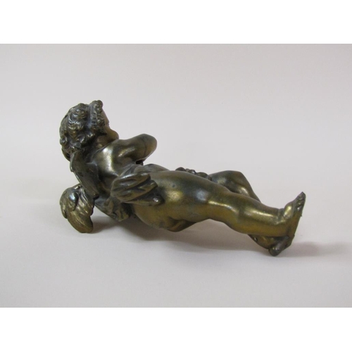 31 - A gilt metal figure of a cherub, 28cm l.