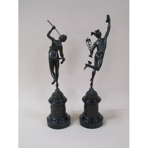 37 - A pair of patinated bronze figures on turned marble bases, both with embossed collars depicting Bacc... 