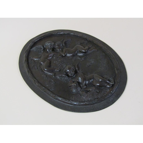 38 - A pair of patinated bronze oval plaques, after the original, two cherubs in the clouds & one cherub ... 