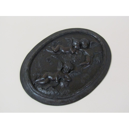 38 - A pair of patinated bronze oval plaques, after the original, two cherubs in the clouds & one cherub ... 