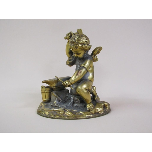 41 - A late 19c gilt metal figure group of a Blacksmith cherub, 16cm h.