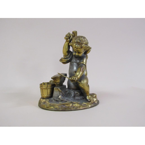 41 - A late 19c gilt metal figure group of a Blacksmith cherub, 16cm h.