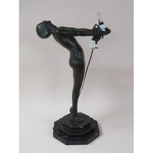 44 - A 1920/30's bronze standing electrolier in the form of a naked female on a stepped marble base, the ... 