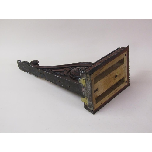 58 - A pair of 19c mahogany wall brackets, the platform with carved edge supported on carved scroll and l... 
