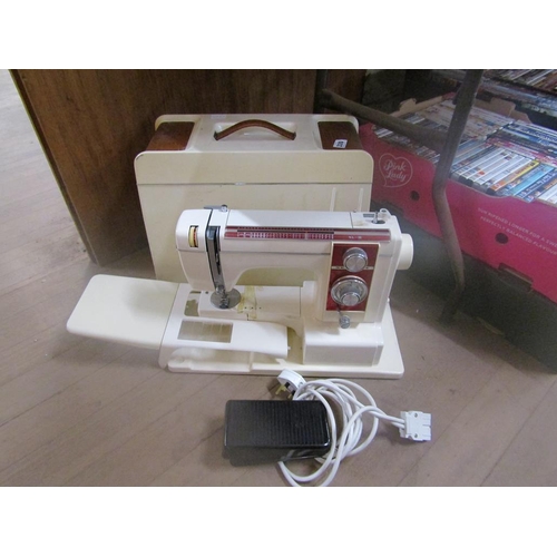 330 - ELECTRIC SEWING MACHINE IN CASE