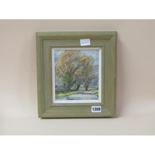 1269 - BRIAN BENNETT - TREES NEXT TO THE STREAM, SIGNED OIL ON BOARD.  FRAMED 17 x 14 cms