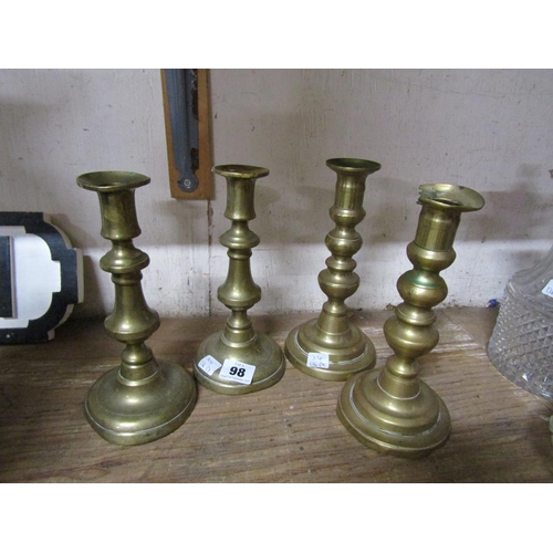 98 - TWO PAIRS OF ANTIQUE BRASS CANDLESTICKS
