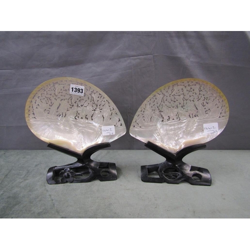 1393 - TWO MOTHER OF PEARL CARVED AND PIERCED ORIENTAL PATTERNED SHELL DISPLAYS, EACH 23cms APPX WIDE