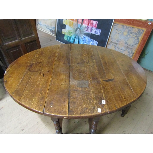 1753 - EARLY 18c TWIN FLAP OAK OVAL GATELEG TABLE WITH BOBBIN TURNED SUPPORTS 148cms W OPEN x 75cms H