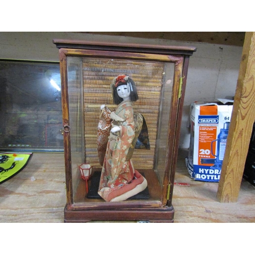 65 - CASED ORIENTAL DOLL