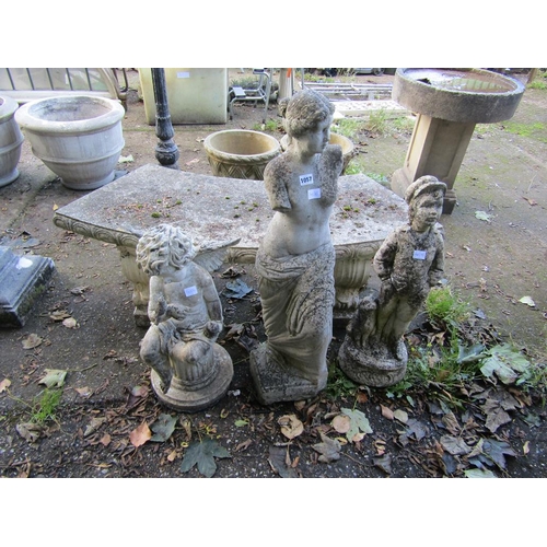 1057 - TWO STONE GARDEN FIGURES; PLASTIC FIGURE