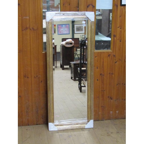 1214 - MOULDED GILT FRAME WALL MIRROR, 134CM X 54CM