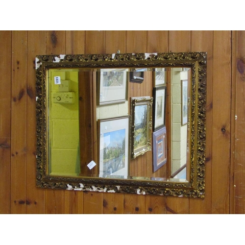 1223 - MOULDED GILT FRAMED WALL MIRROR, 94CM X 56CM