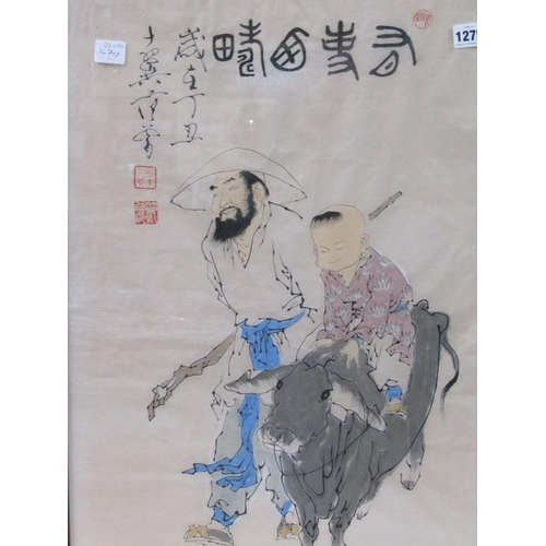 1275 - ORIENTAL COLOURED PRINT  - CHILD ON BUFFALO WITH HANDLER, F/G, 69CM X 44CM